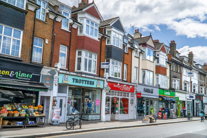 Commercial / Bridging Finance: Row of local shopfronts and commercial properties on a high street