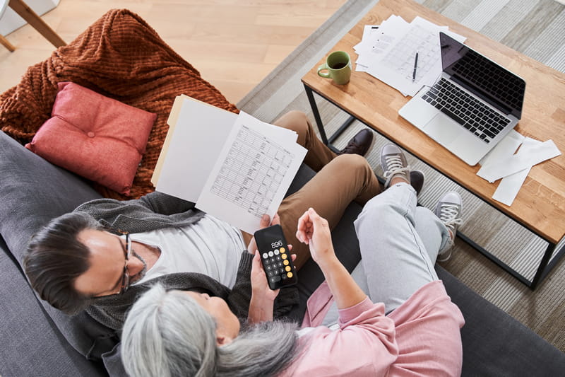 Remortgaging: Couple reviewing mortgage and household finances at home